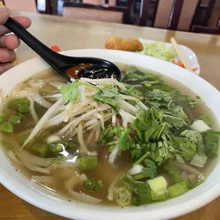 Regular pho with rare beef, tendon and tripe.  Broth was warm and underwhelming