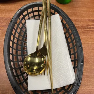 a bowl of rice and chopsticks