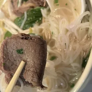 a bowl of beef and noodles