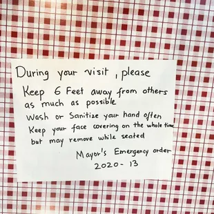 Signage on each dining table.