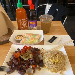 Shaking beef with fried rice, fresh spring rolls and Vietnamese iced coffee