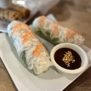 two rolls with dipping sauce