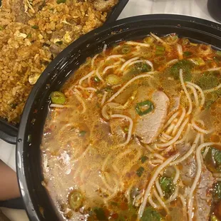 a bowl of soup and a plate of rice