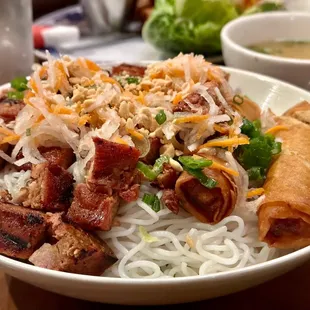 B7. Grilled Pork and Egg Rolls Salad Bowl