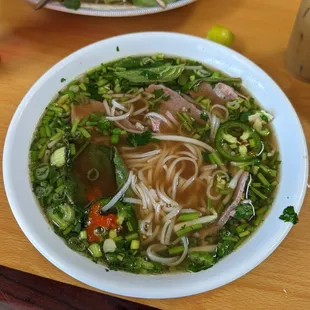 a bowl of soup and a plate of salad