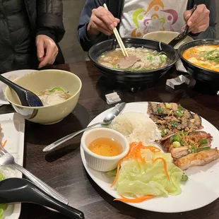 Left to right: Spring rolls, (extra bowl), rice plate, #1 pho, laksa.