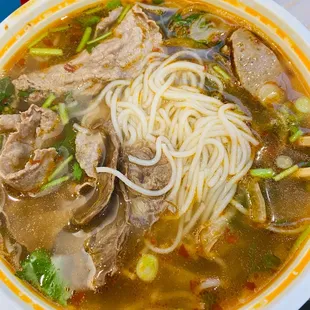 a bowl of beef noodle soup