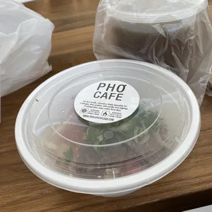 a plastic plate with a salad in it