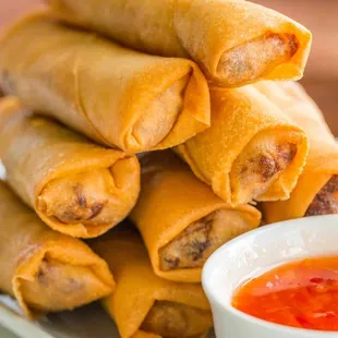 a plate of food with dipping sauce