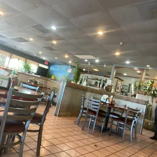 a restaurant with tables and chairs