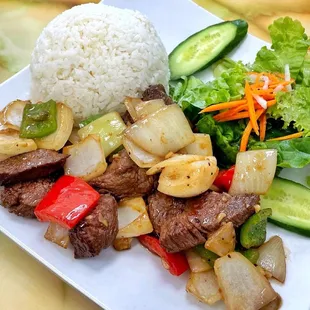 a plate of food with rice and vegetables