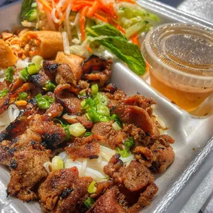 Bun thit nuong cha gao (noodles with grilled pork topped with herbs, lettuce, peanuts, spring rolls, and more) *yummy!*