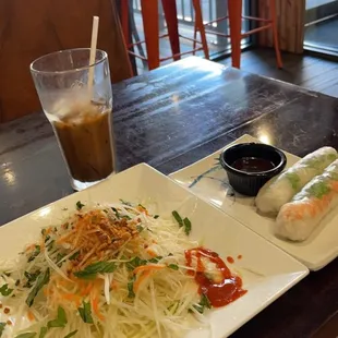 Spicy Papaya Salad, iced coffee and Shrimp Rolls..  excellent flavor, very fresh.