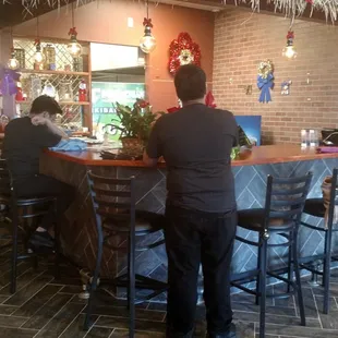 Tiki bar at entrance, also where you pick up carryout