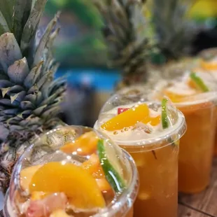 pineapples and fruit in plastic cups