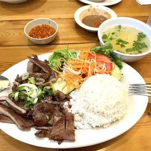 Grilled Pork and rice with a side of beef broth is so delicious! Pork is very tender and has a really good flavor.