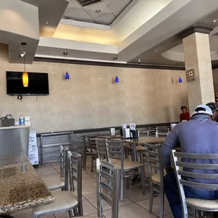a man sitting at a table in a restaurant