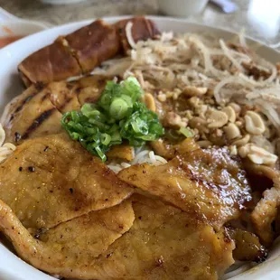 Vermicelli with charbroiled pork, pork skins, and egg roll