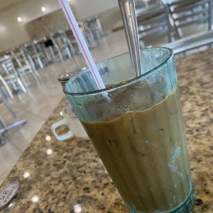 Iced coffee served with condensed milk- strong taste for those who do not drink caffeine often