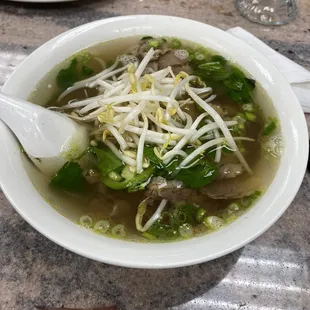 a bowl of soup with a spoon