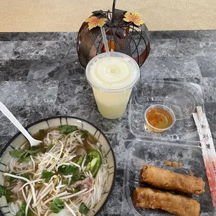 Vietnamese spring rolls, pho with eye-of-round steak and well done brisket, and a pineapple smoothie.