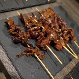 Roast duck skin skewers
