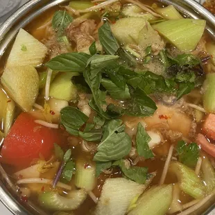 a bowl of soup with vegetables