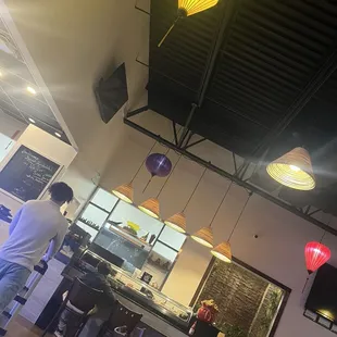 Some seating and the sushi bar