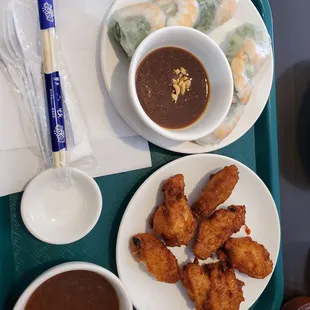 Chicken wings and shrimp spring rolls