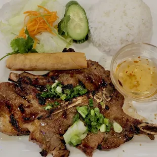 Grilled pork chop, Egg Roll, and Rice
