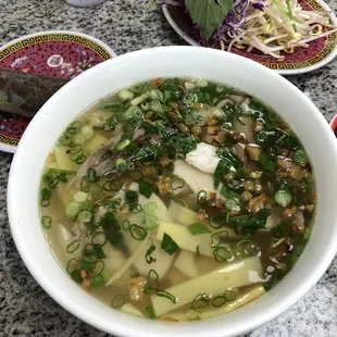 Clear noodles with sliced chicken and sliced bamboo (note: dried bamboo on menu but is not available)