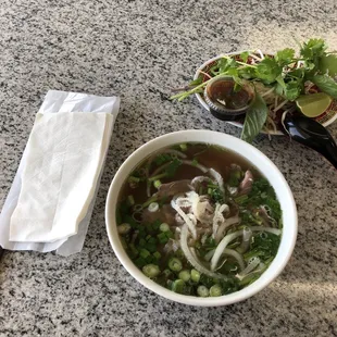 Pho dac biet (sm) with individually packaged cutlery set (napkins, hoisin/sriracha, spoon and chopsticks)