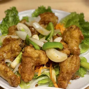 a plate of fried tofu and vegetables
