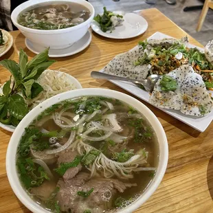 two bowls of soup and a plate of rice