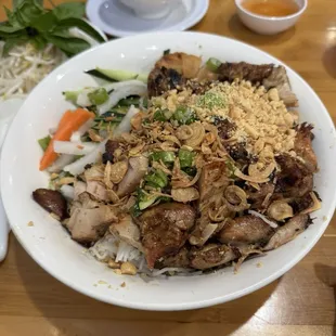 Grill Chicken with Vermicelli.   Pickle veggies are pretty largely sliced.  Need more sauce given amount of noodles.