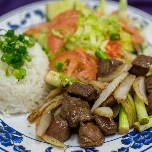 a plate of beef and vegetables