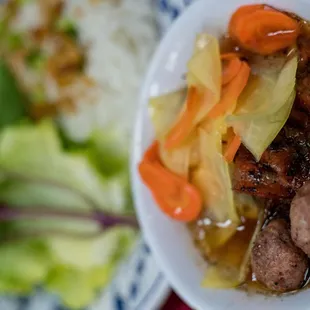 a bowl of soup with meat and vegetables