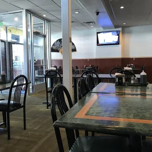 a restaurant with tables and chairs