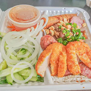 90. BÁNH HỎI ĐẶC BIỆT - HOUSE SPECIAL VERMICELLI PLATE Comes with shrimp on sugarcane, grilled pork, pork meatballs, and egg roll.