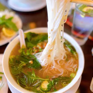 a bowl of soup with noodles and vegetables