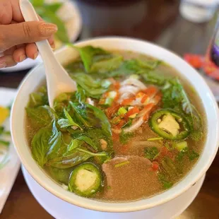 a bowl of soup with a spoon in it