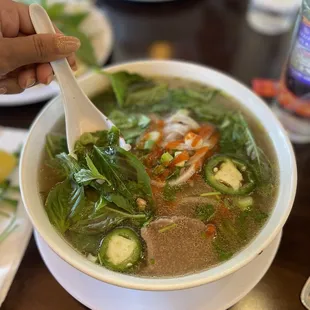a bowl of soup with a spoon in it