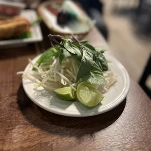 Essentials: bean sprouts, basil, and limes.