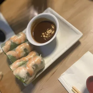 a plate of food with dipping sauce