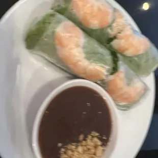 a plate of food with dipping sauce