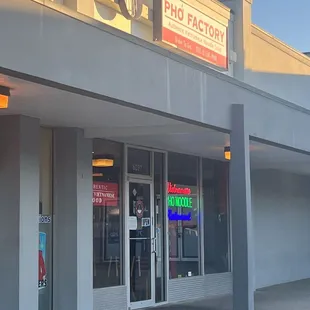 the front entrance of a pho factory