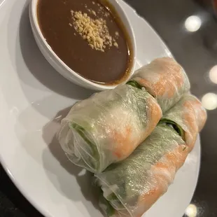a plate of food with dipping sauce
