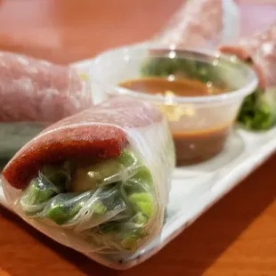 a sandwich wrapped in plastic wrap