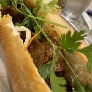 a sandwich with meat and vegetables