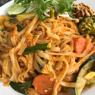 a plate of noodles and vegetables